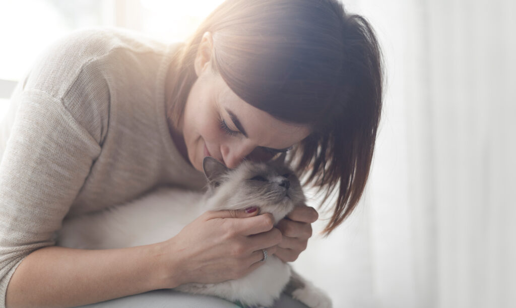 woman and a happy cat